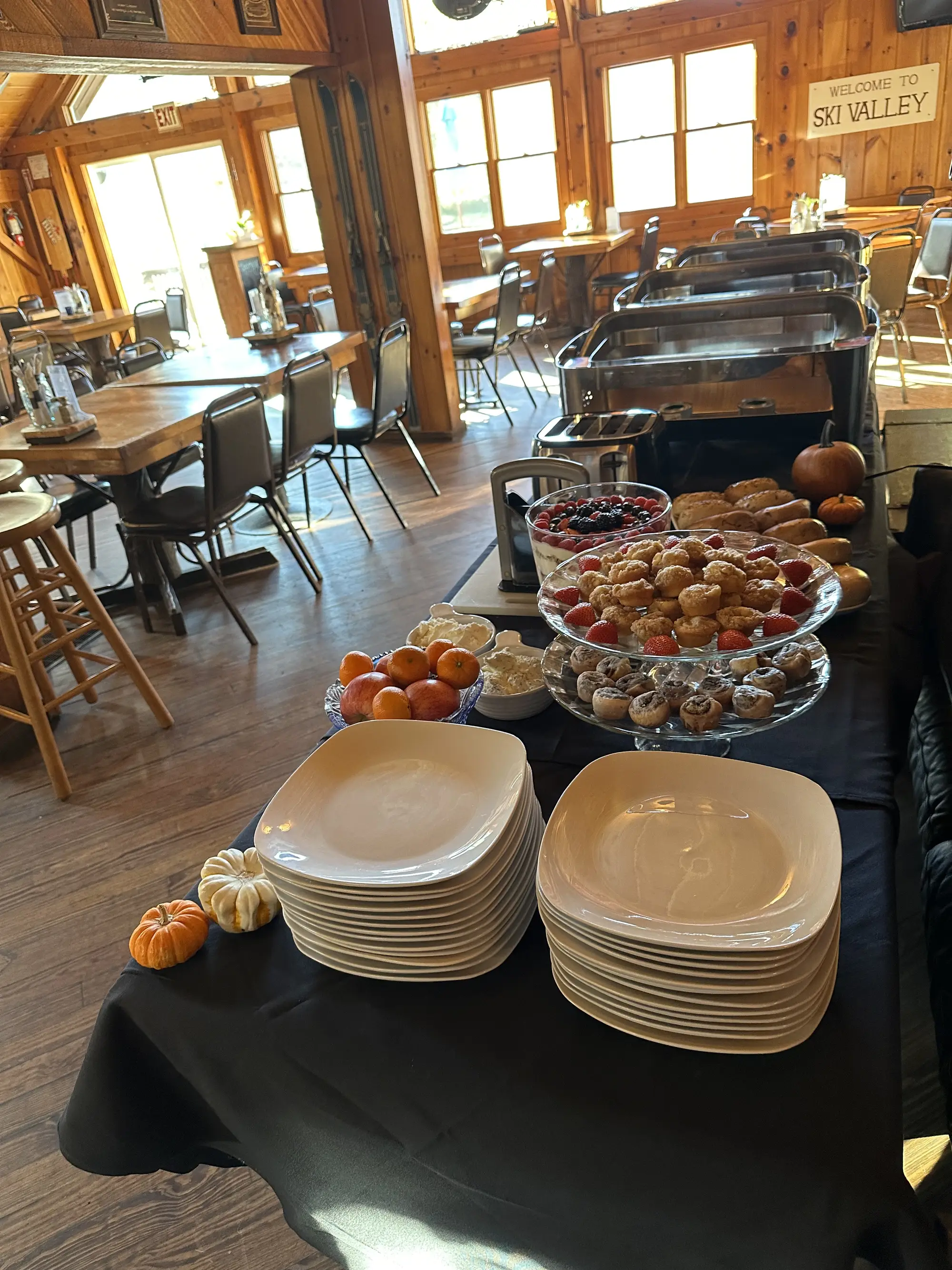 Buffet display with plates and appetizer setup