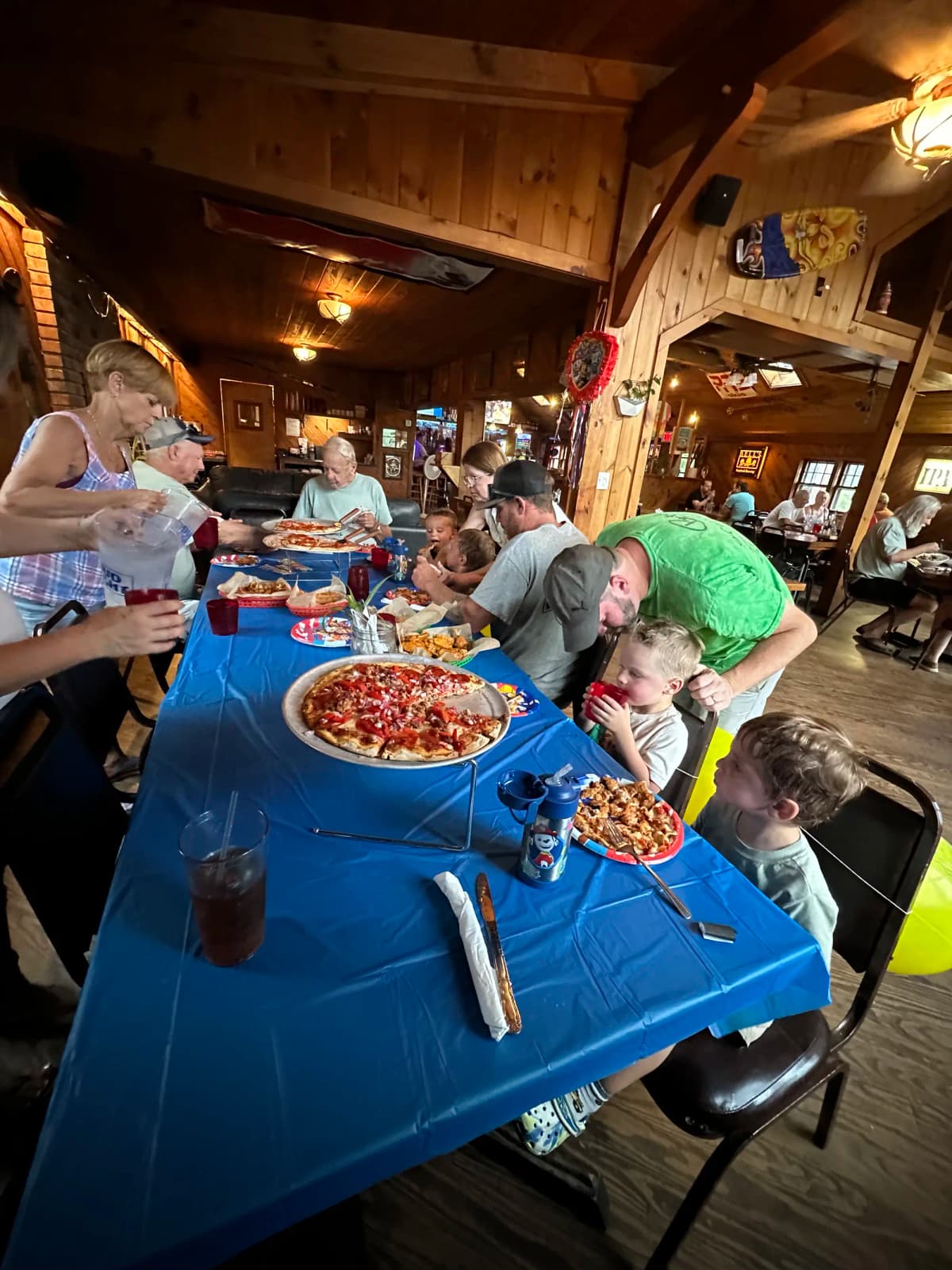 Casual party with pizza and buffet spread