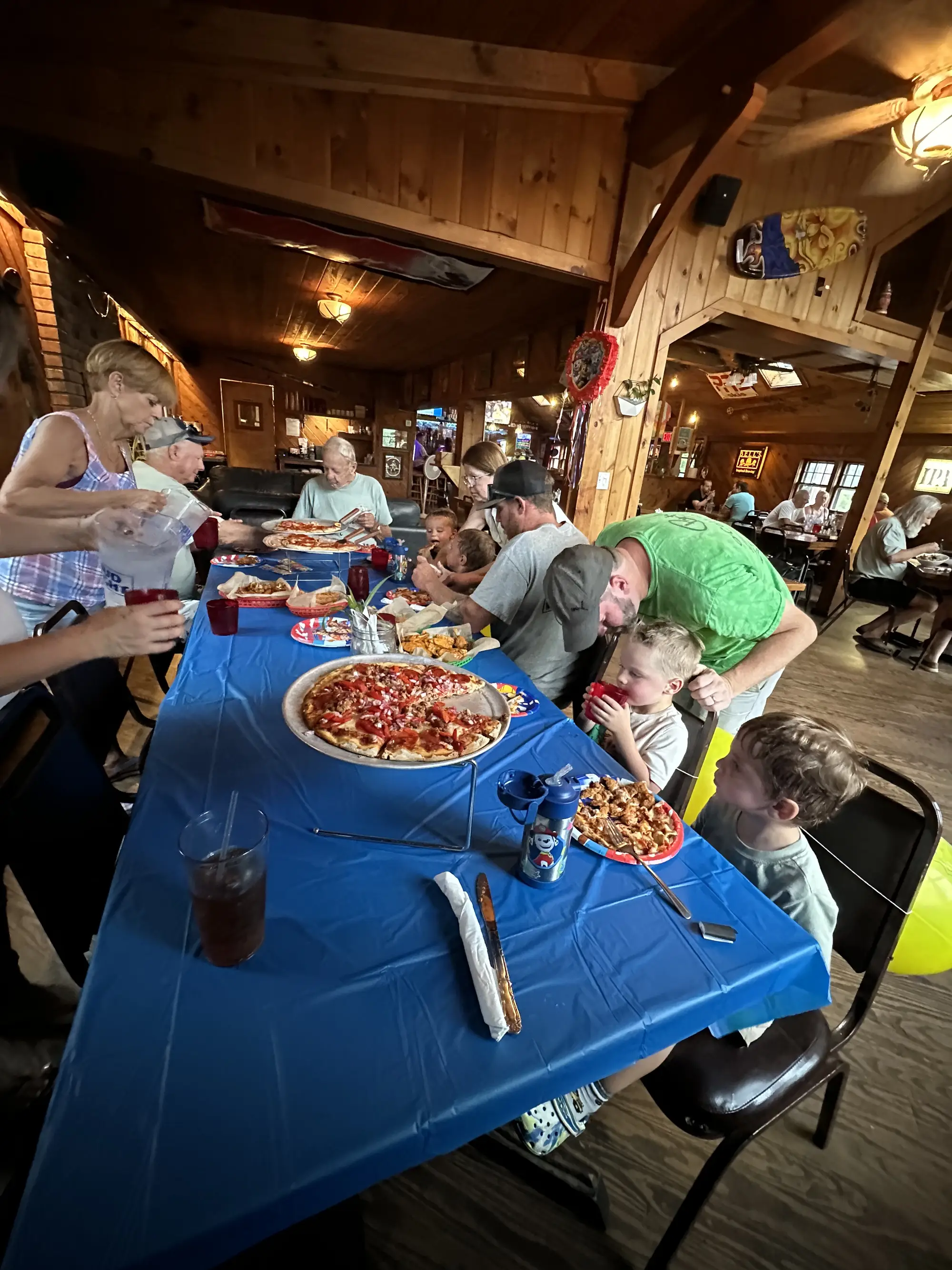 Casual party with pizza and buffet spread