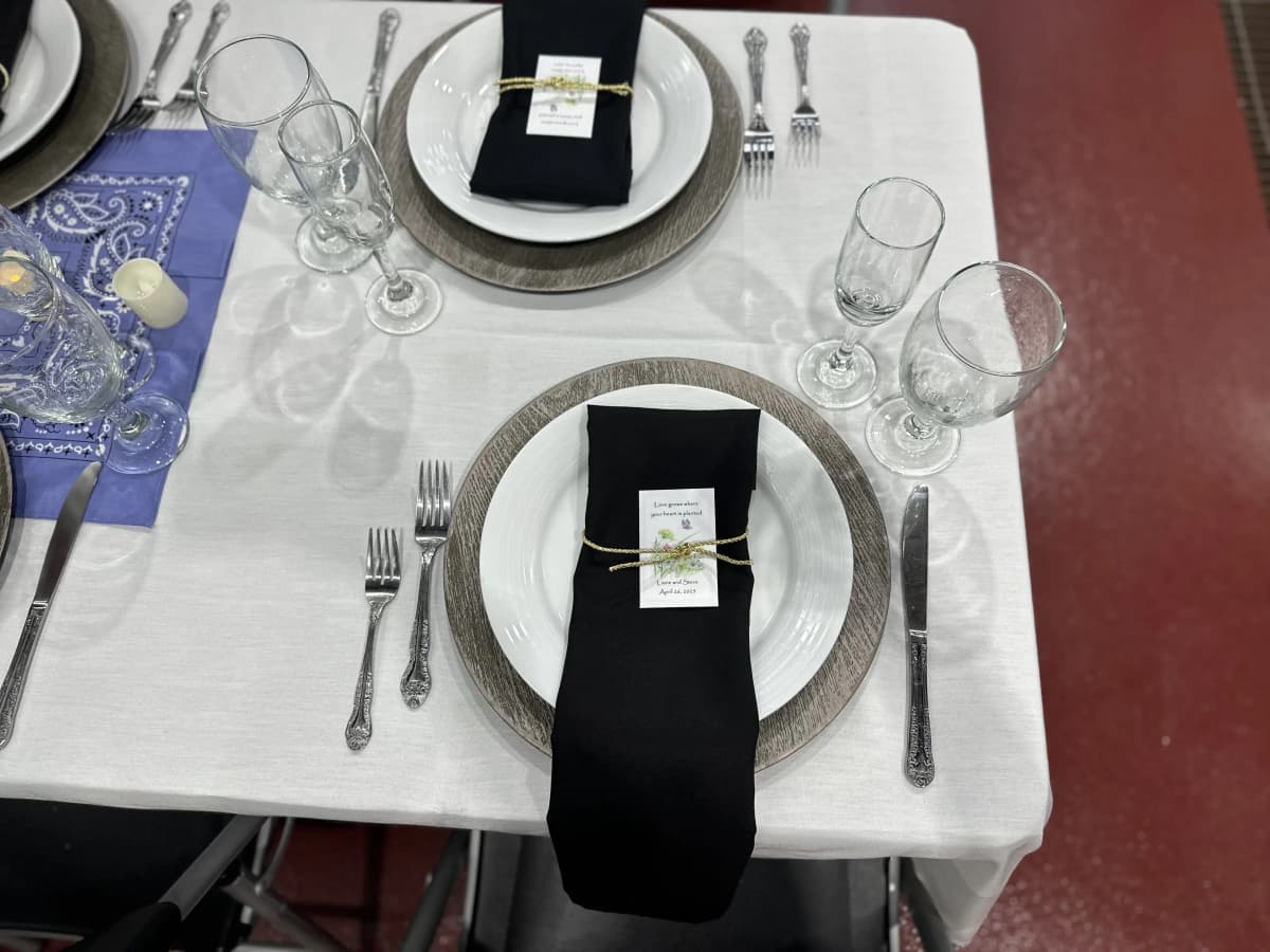 Elegant place setting with black napkin