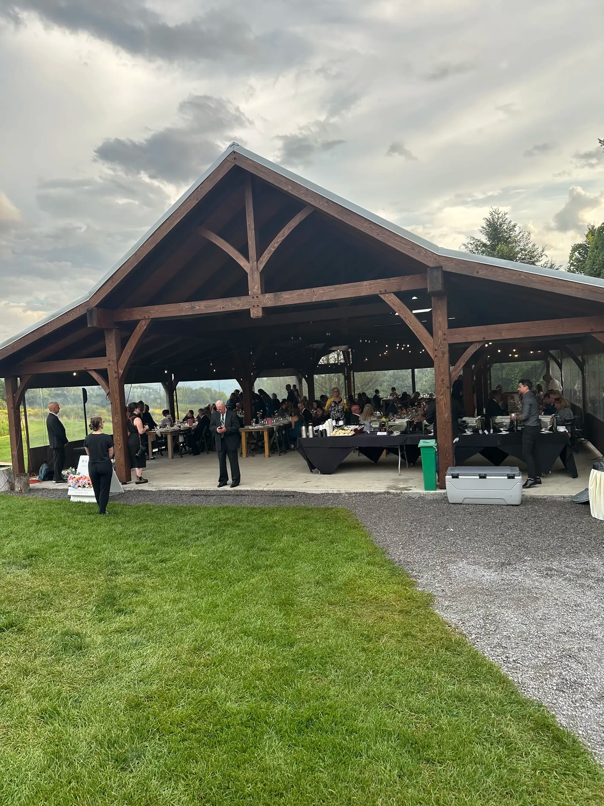 Wedding reception under pavilion with guests