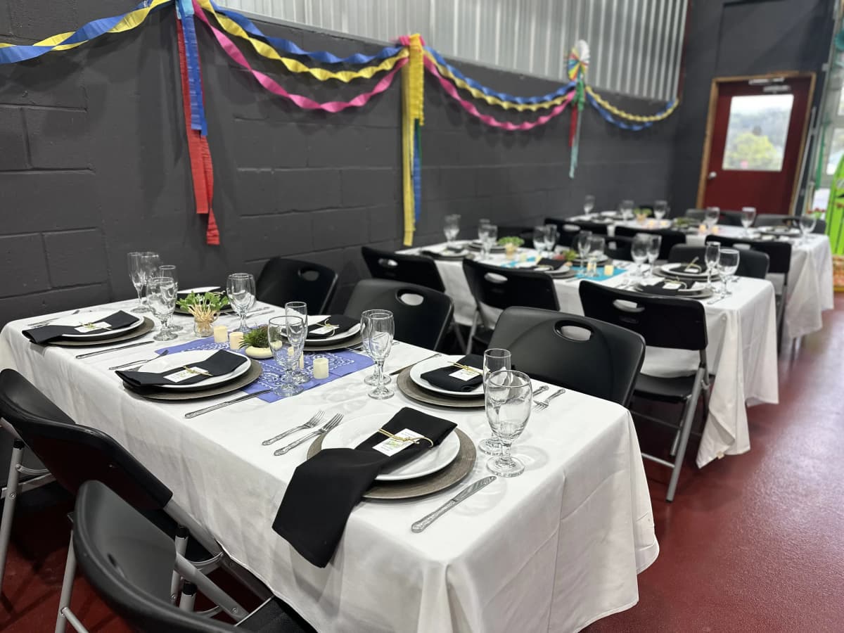 Rehearsal event with festive table setup and decorations