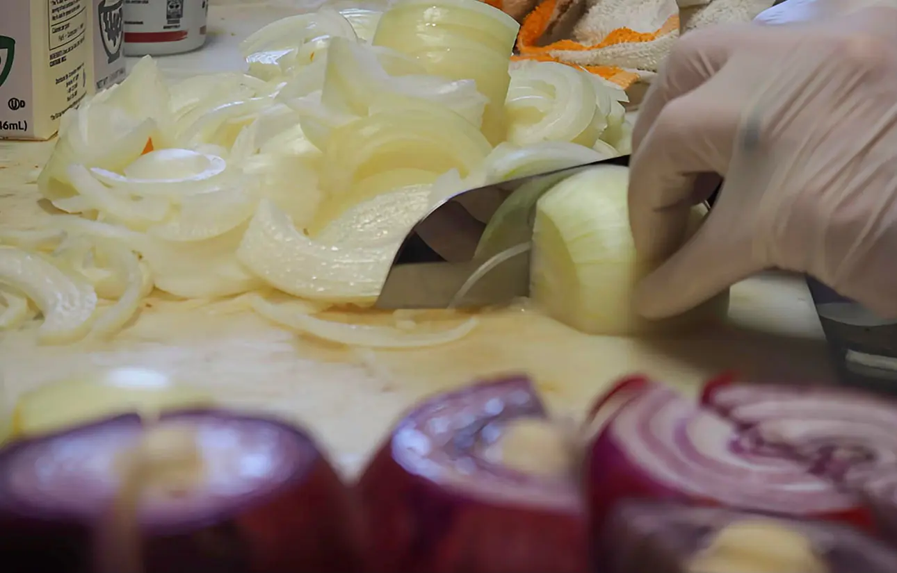 Photo of chef chopping onions
